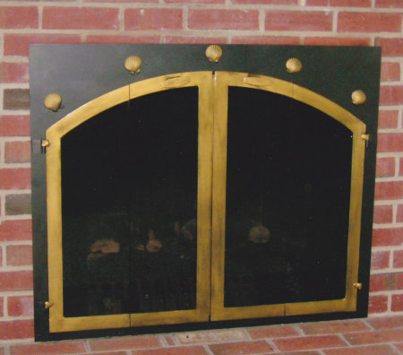 Chatham Square to Arch with five shells across top frame black frame with antique brass shells and vice bifold doors smoked glass comes with slide mesh spark screen